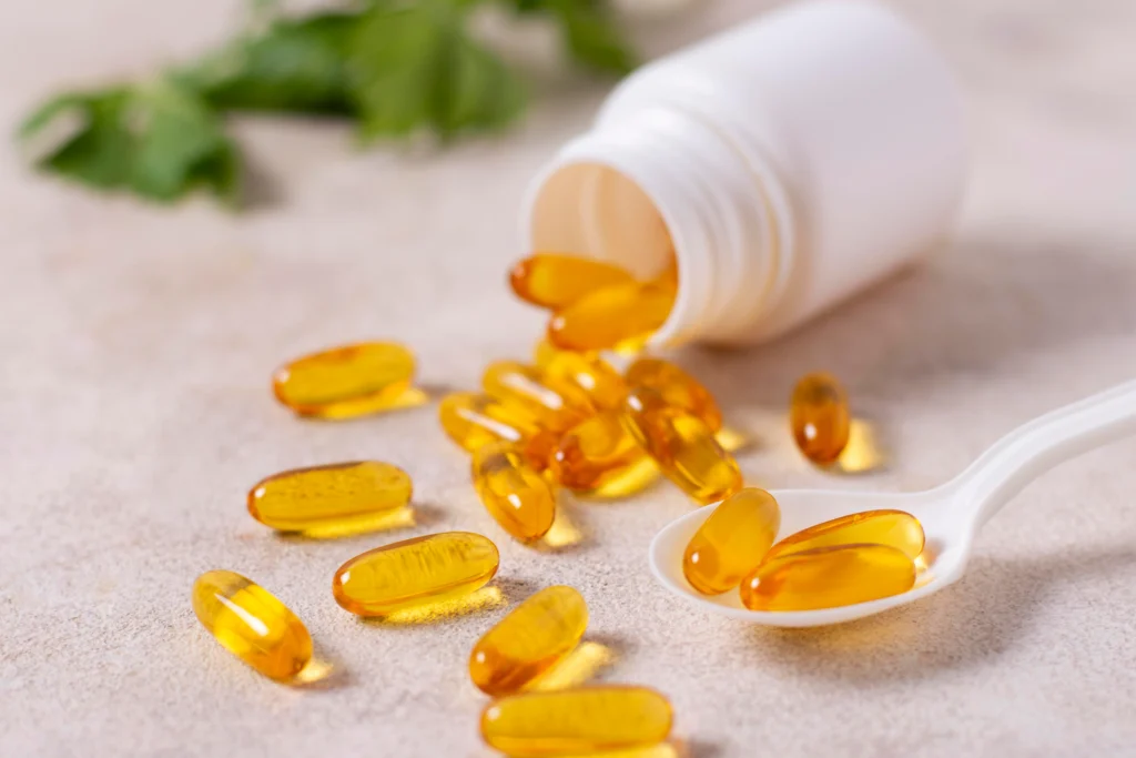 Image of a jar filled with yellow supplement pills, essential for supporting health and well-being.